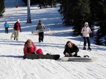 People on snow covered landscape