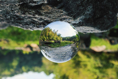 Close-up of crystal ball on rock