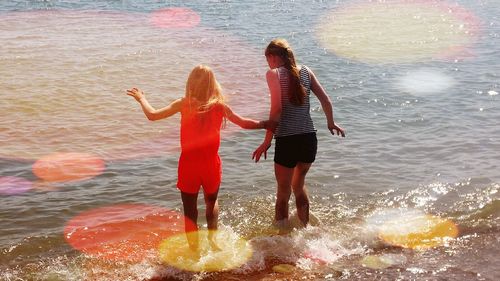 Full length of woman standing on shore