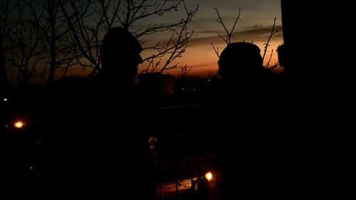 Silhouette man against sky at sunset