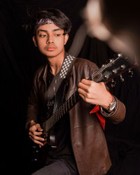 Young man playing guitar