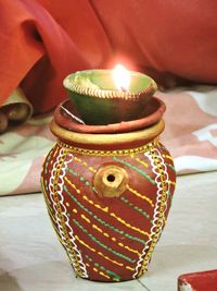 Close-up of candles on table