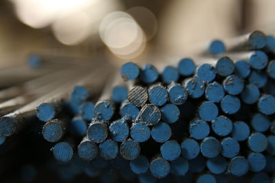 Close-up of  metal rods with blue end 