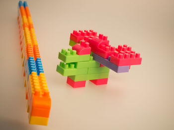 High angle view of toys on table against white background