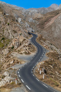 High angle view of road between mountains