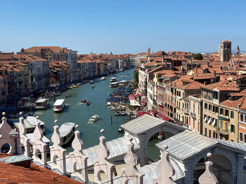 Canal grand venice. high angle view of buildings by sea against clear sky