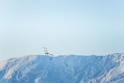 Scenic view of snowcapped mountains against clear sky