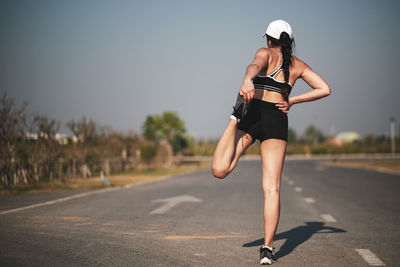 Woman running on road