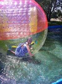 High angle view of man floating on water