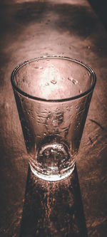 High angle view of glass of water on table