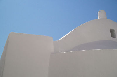 Low angle view of building against blue sky