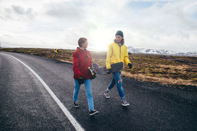 People on road against sky