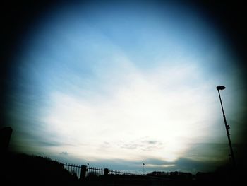 Low angle view of silhouette trees against sky