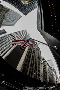 Low angle view of modern buildings against sky in city