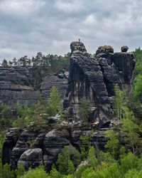 Low angle view of rock formations against sky