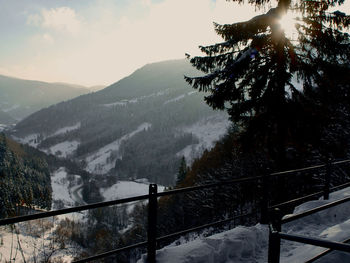 Scenic view of snowcapped mountains against sky during winter