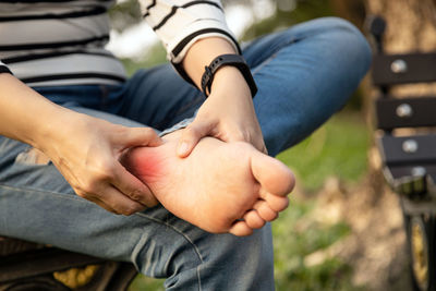 Midsection of couple holding hands