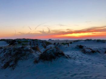 Scenic view of landscape against sky during sunset