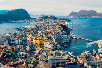 Aerial view of cityscape by sea