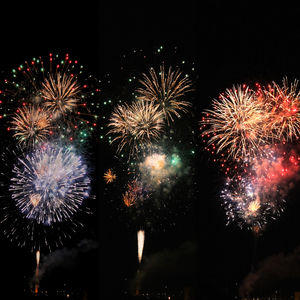 Low angle view of firework display at night