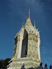 Low angle view of statue of temple against building