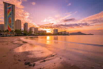 Scenic view of hawaii beach against sky during sunrise