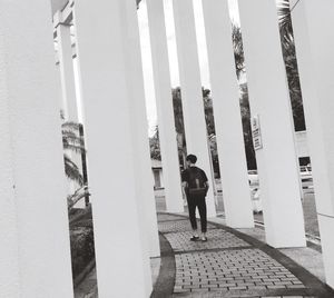 Full length of man with umbrella against sky