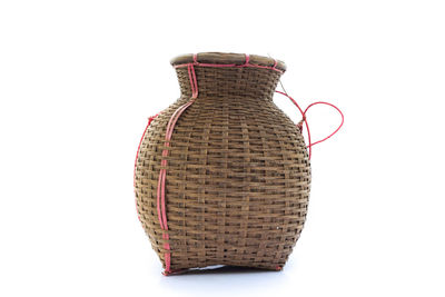 Close-up of wicker basket against white background