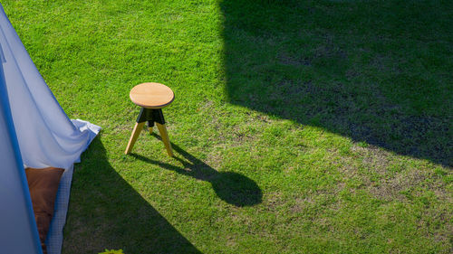 Low section of woman walking on field