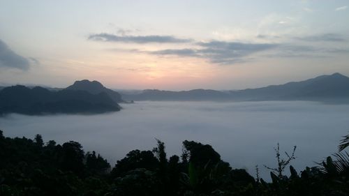 Scenic view of mountains against sky during sunset