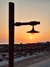 Scenic view of sea against clear sky at sunset