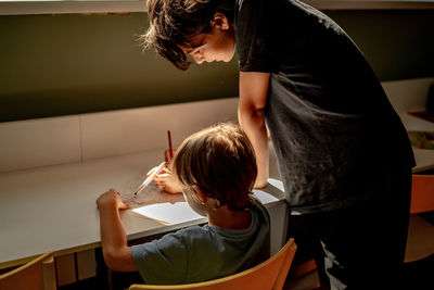 Side view of man working at home