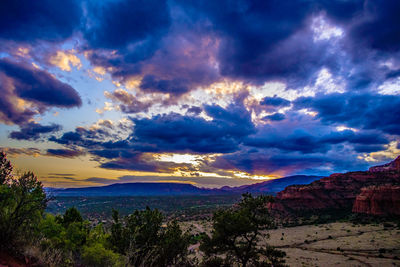 Scenic view of dramatic sky over landscape