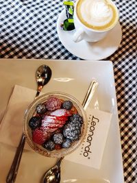 High angle view of coffee cup on table