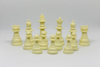 Close-up of chess pieces against white background