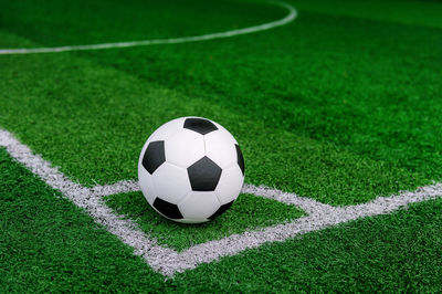 Close-up of soccer ball on field