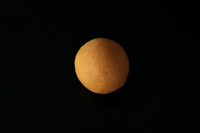 Close-up of orange against black background