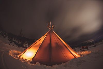 Illuminated tent during winter