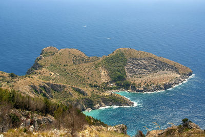 High angle view of sea against clear blue sky