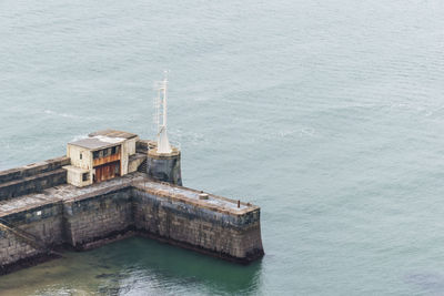 High angle view of built structure by sea