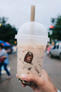 Close-up of hand holding ice cream cone