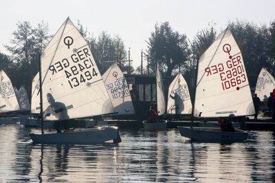 Boats in water against sky