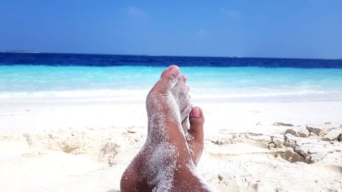 Low section of person on beach