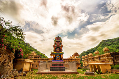 Built structure against cloudy sky