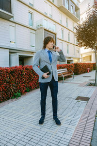 Full length of young man standing outdoors