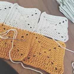 Close-up of crochet needle on table