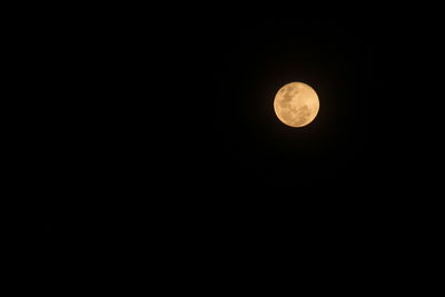 Low angle view of moon against sky at night