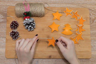 High angle view of woman holding cookies