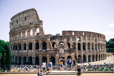 Group of people in front of the colosseum, italy