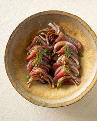 High angle view of food on a table. carpaccio made with bonito fish.